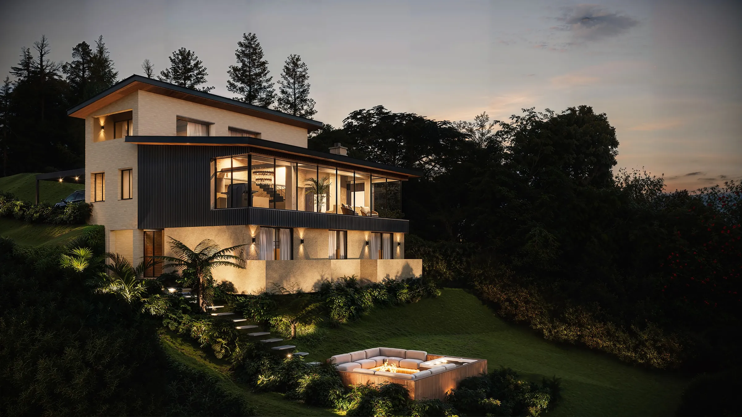 Casa de dos pisos iluminada al atardecer sobre una ladera en El Retiro, Antioquia